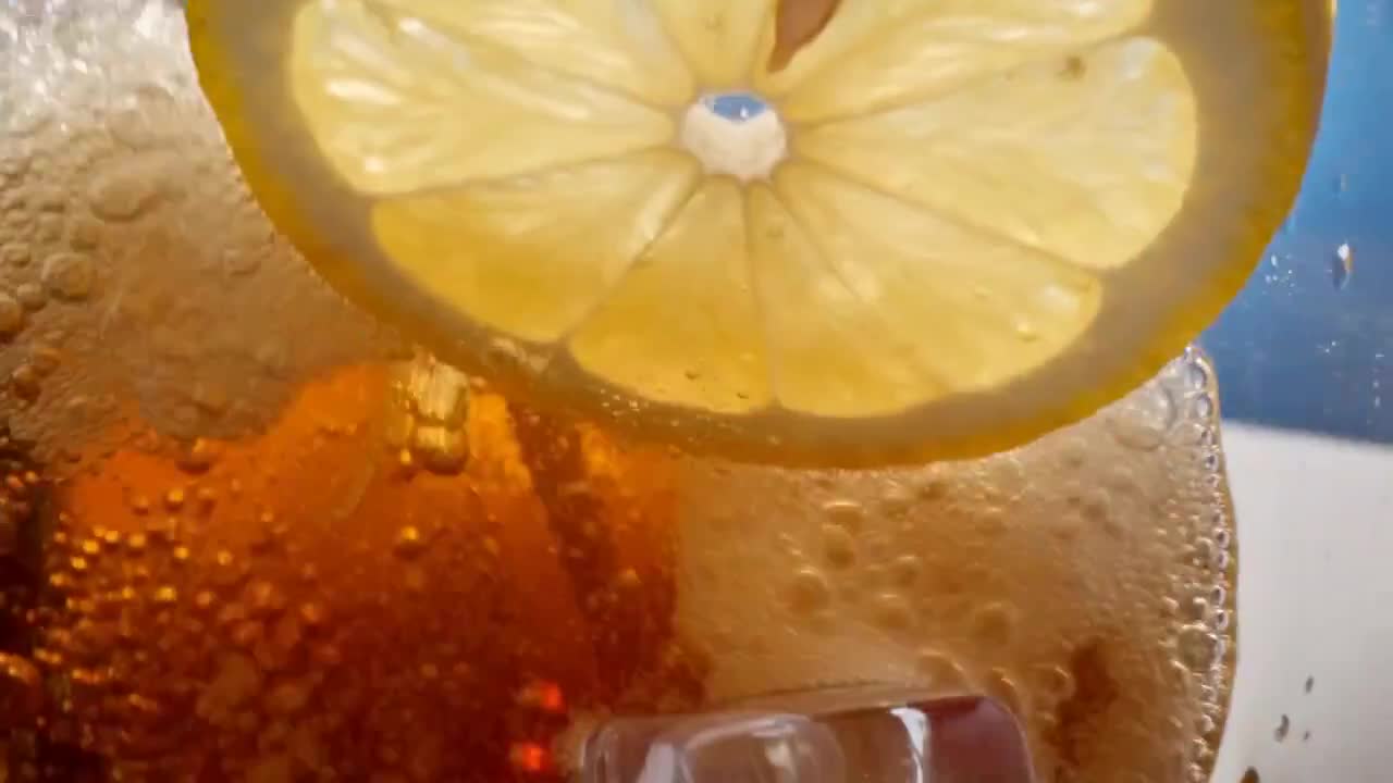 Seedance 2.0 Prompt: Macro POV Ice Cube in Soda
