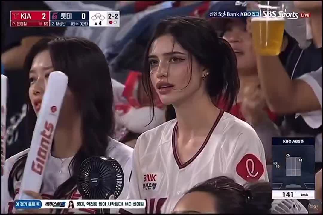 Seedance 2.0 Prompt: Pensive Woman at Night Baseball Game