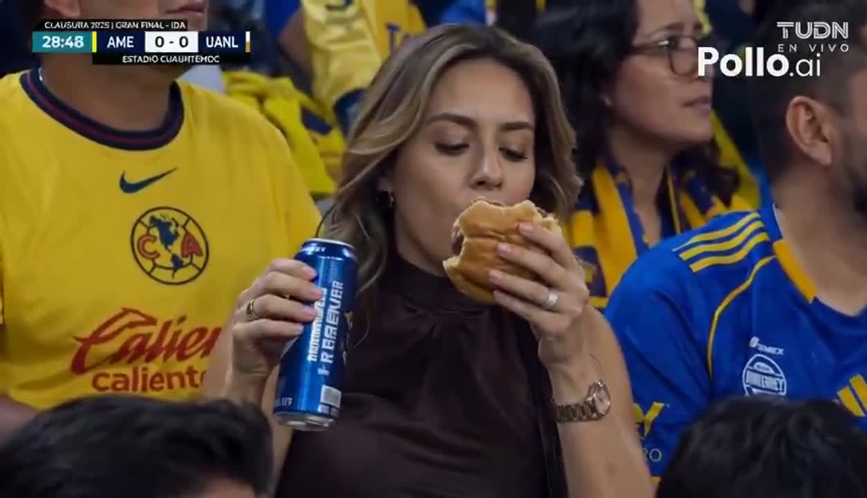 Seedance 2.0 Prompt: Glamorous Woman Eats Cheeseburger at Soccer Match